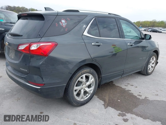 2021 Chevrolet Equinox Premier z VIN 2GNAXNEV9M6140537, wystawiony jako IAAI lot #42016514 z przebiegiem 52 237 mil mil oraz . Historia ofert i sprzedaży dostępna na DreamBid. Obrazek 4.