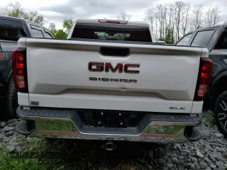 2023 GMC Sierra 1500 with VIN 1GTUUBE84PZ327510, listed as a Copart auction lot 51716385 with 30,590 mi miles and Salvage Title. Bid and sale history available at DreamBid. Image 6.