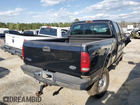 2000 Ford F-350 XL with VIN 1FTSW31FXYED30772, listed as a Copart auction lot 50606445 with 402,923 mi miles and Salvage title. Bid and sale history available at DreamBid. Image 3.