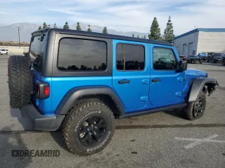 2022 Jeep Wrangler Unlimited Willys with VIN 1C4HJXDM0NW152614, listed as a Copart auction lot 83208664 with 51,913 mi miles and Salvage Title. Bid and sale history available at DreamBid. Image 3.