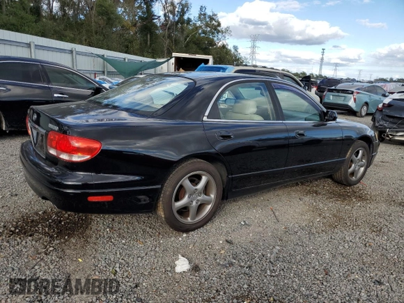 2002 Mazda Millenia z VIN JM1TA221421729790, wystawiony jako Copart lot #84460794 z przebiegiem 68 102 mil mil oraz Szkoda całkowita • Salvage title. Historia ofert i sprzedaży dostępna na DreamBid. Obrazek 3.