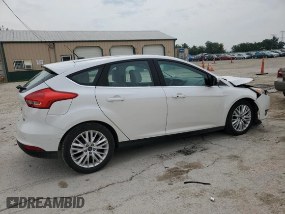2016 Ford Focus Titanium z VIN 1FADP3N23GL345904, wystawiony jako Copart lot #60139525 z przebiegiem 97 572 mil mil oraz Szkoda całkowita • Salvage title. Historia ofert i sprzedaży dostępna na DreamBid. Obrazek 3.