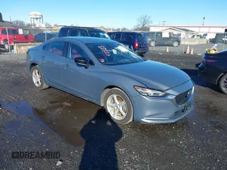 2021 Mazda 6 Carbon Edition with VIN JM1GL1WY3M1603064, listed as a IAAI auction lot 41199852 with 118,307 mi miles and . Bid and sale history available at DreamBid. Image 1.