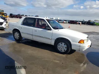 1994 Plymouth Acclaim z VIN 3P3AA4630RT275149, wystawiony jako Copart lot #79877324 z przebiegiem 125 175 mil mil oraz Szkody całkowita. Historia ofert i sprzedaży dostępna na DreamBid. Obrazek 4.