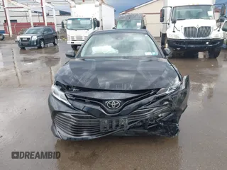 2019 Toyota Camry LE with VIN 4T1B11HK2KU263910, listed as a IAAI auction lot 42060008 with 31,433 mi miles and . Bid and sale history available at DreamBid. Image 12.