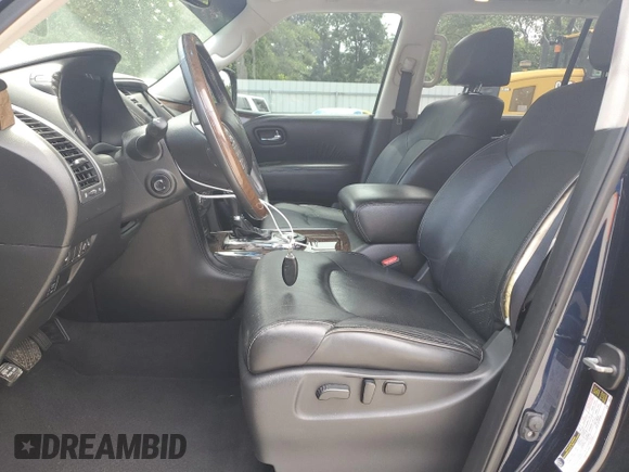 2016 Infiniti QX80 with VIN JN8AZ2NF9G9610685, listed as a Copart auction lot 57154685 with 94,176 mi miles and Salvage title. Bid and sale history available at DreamBid. Image 7.