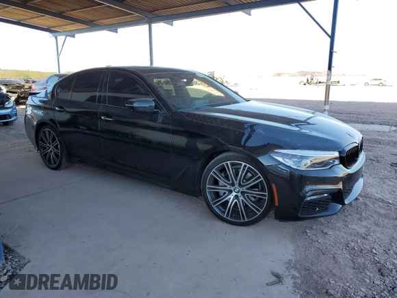 2018 BMW 5 Series 540i xDrive with VIN WBAJE7C5XJWD52054, listed as a Copart auction lot 47306535 with 49,185 mi miles and Salvage title. Bid and sale history available at DreamBid. Image 4.