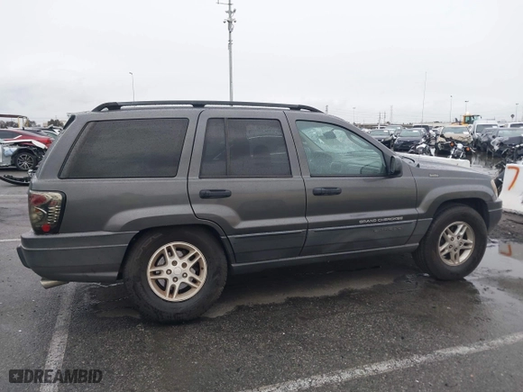 2004 Jeep Grand Cherokee Laredo with VIN 1J4GX48S14C177923, listed as a IAAI auction lot 41745772 with 242,506 mi miles. Bid and sale history available at carsss.com. Image 13.