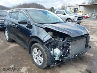 2018 Kia Sportage LX with VIN KNDPMCAC3J7380179, listed as a IAAI auction lot 41672067 with 134,390 mi miles. Bid and sale history available at carsss.com. Image 1.