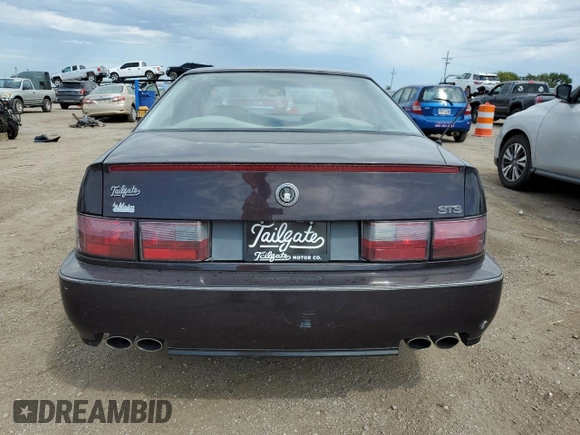 1992 Cadillac Seville z VIN 1G6KY53BXNU804126, wystawiony jako Copart lot #69219394 z przebiegiem 100 647 mil mil oraz Czysty tytuł • Clean title. Historia ofert i sprzedaży dostępna na DreamBid. Obrazek 6.