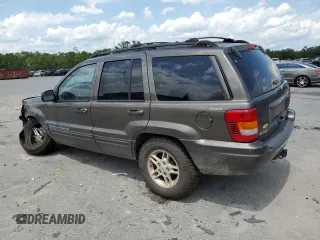 1999 Jeep Grand Cherokee Limited with VIN 1J4GW68S6XC713297, listed as a Copart auction lot 55264384 with 98,912 mi miles and Salvage Title. Bid and sale history available at carsss.com. Image 2.