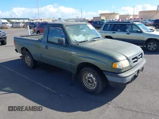 2002 Mazda B-Series 2WD Truck SX with VIN 4F4YR12D32TM21251, listed as a IAAI auction lot 41273974 with 155,165 mi miles. Bid and sale history available at carsss.com. Image 1.