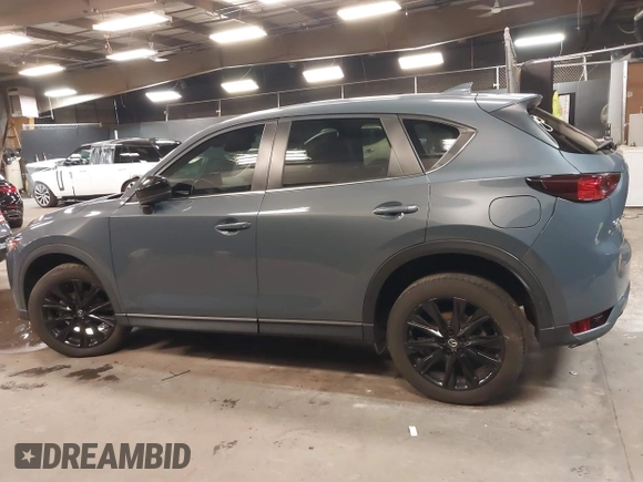 2021 Mazda CX-5 Touring with VIN JM3KFBCM5M0394707, listed as a IAAI auction lot 41887973 with 44,670 mi miles. Bid and sale history available at carsss.com. Image 15.