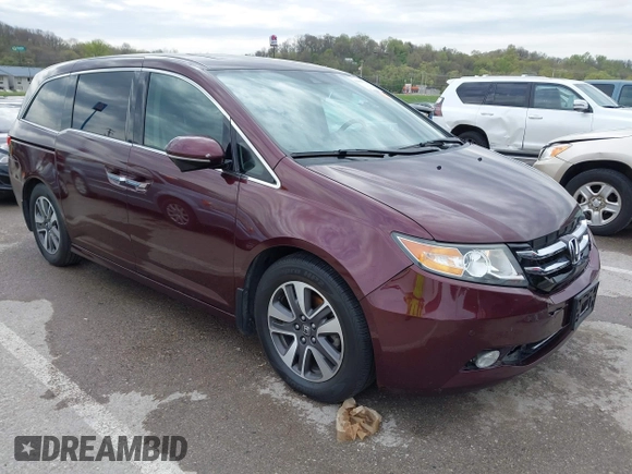 2014 Honda Odyssey Touring with VIN 5FNRL5H9XEB073156, listed as a IAAI auction lot 41990714 with 166,129 mi miles and . Bid and sale history available at DreamBid. Image 1.