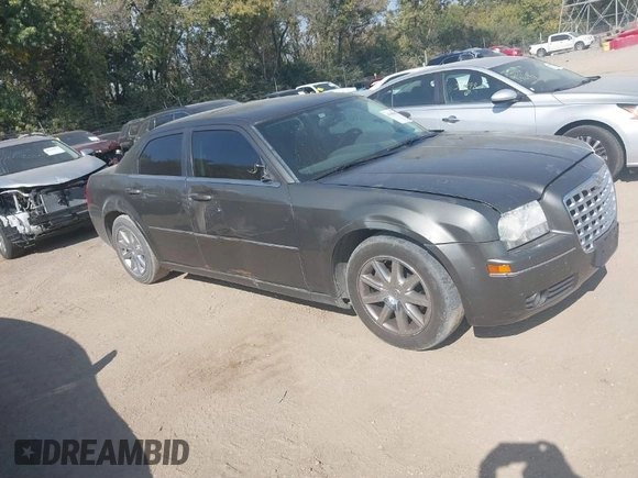 2009 Chrysler 300 Touring with VIN 2C3LA53V09H520923, listed as a IAAI auction lot 40408803 with 216,747 mi miles. Bid and sale history available at carsss.com. Image 1.