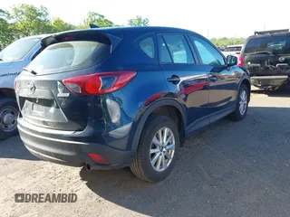 2016 Mazda CX-5 Sport with VIN JM3KE2BY3G0657904, listed as a IAAI auction lot 42127897 with 153,855 mi miles. Bid and sale history available at carsss.com. Image 4.