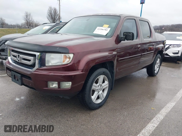 2009 Honda Ridgeline RTL with VIN 5FPYK16529B100032, listed as a IAAI auction lot 41206781 with 130,694 mi miles and . Bid and sale history available at DreamBid. Image 2.