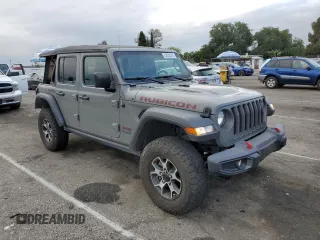 2022 Jeep Wrangler Unlimited Rubicon with VIN 1C4HJXFGXNW158038, listed as a Copart auction lot 53020575 with 14,355 mi miles and Salvage title. Bid and sale history available at DreamBid. Image 4.