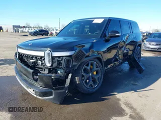 2024 Rivian R1S Adventure z VIN 7PDSGABA8RN039833, wystawiony jako IAAI lot #41867083 z przebiegiem Nie podano mil oraz . Historia ofert i sprzedaży dostępna na DreamBid. Obrazek 2.
