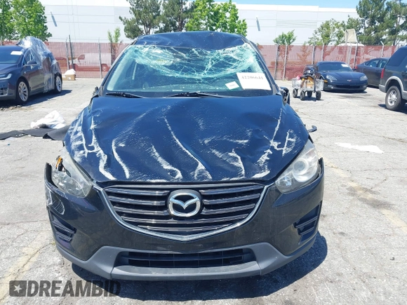 2016 Mazda CX-5 Sport with VIN JM3KE2BY4G0807776, listed as a IAAI auction lot 42206641 with 136,809 mi miles and . Bid and sale history available at DreamBid. Image 6.