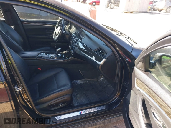 2016 BMW 5 Series 528i xDrive with VIN WBA5A7C56GG145318, listed as a IAAI auction lot 41414556 with 122,879 mi miles. Bid and sale history available at carsss.com. Image 5.