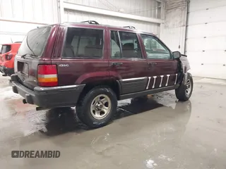 1995 Jeep Grand Cherokee Laredo with VIN 1J4GZ58S2SC679918, listed as a IAAI auction lot 41840415 with 261,434 mi miles. Bid and sale history available at carsss.com. Image 4.
