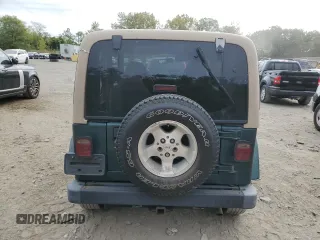2000 Jeep Wrangler Sahara with VIN 1J4FA59S1YP747919, listed as a Copart auction lot 72278044 with 157,360 mi miles and Salvage Title. Bid and sale history available at carsss.com. Image 6.