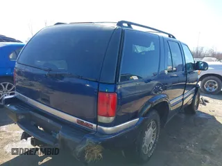 1999 GMC Jimmy SLE with VIN 1GKDT13W3X2553792, listed as a IAAI auction lot 41876489 with 266,884 mi miles. Bid and sale history available at carsss.com. Image 4.