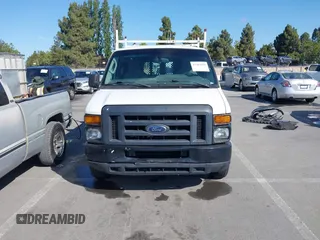 2013 Ford Econoline Cargo Commercial with VIN 1FTNE1EW7DDA98789, listed as a IAAI auction lot 42382594 with 251,602 mi miles and . Bid and sale history available at DreamBid. Image 12.