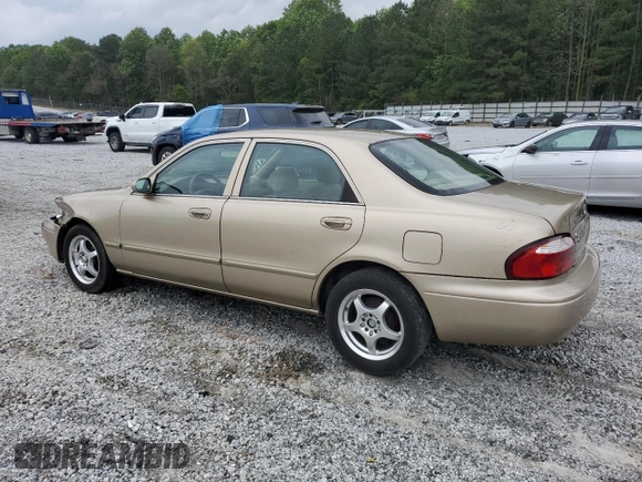 2001 Mazda 626 LX z VIN 1YVGF22C715202574, wystawiony jako Copart lot #54132915 z przebiegiem 237 041 mil mil oraz Szkoda całkowita • Salvage title. Historia ofert i sprzedaży dostępna na DreamBid. Obrazek 2.