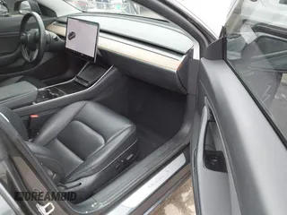 2018 Tesla Model 3 Long Range Battery with VIN 5YJ3E1EA0JF101564, listed as a IAAI auction lot 41902214 with 101,581 mi miles. Bid and sale history available at carsss.com. Image 5.