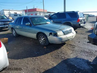 2005 Mercury Grand Marquis LS Premium with VIN 2MEHM75W55X666596, listed as a IAAI auction lot 41812724 with NaN miles. Bid and sale history available at carsss.com. Image 1.