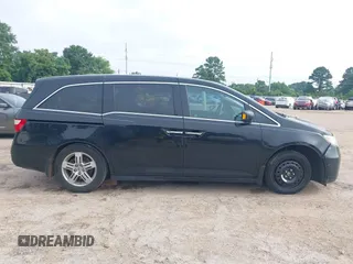 2011 Honda Odyssey Touring with VIN 5FNRL5H90BB070472, listed as a IAAI auction lot 42367710 with 203,589 mi miles and . Bid and sale history available at DreamBid. Image 13.