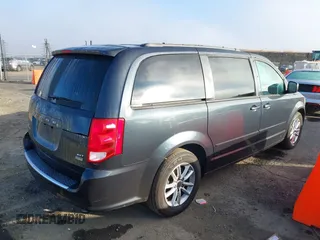 2014 Dodge Grand Caravan SXT with VIN 2C4RDGCG2ER267358, listed as a IAAI auction lot 41001692 with 186,763 mi miles and . Bid and sale history available at DreamBid. Image 4.