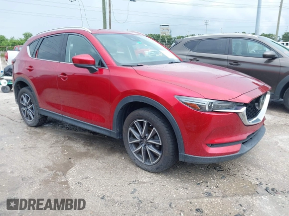 2018 Mazda CX-5 Grand Touring with VIN JM3KFADM5J0437365, listed as a IAAI auction lot 42657919 with 96,760 mi miles and . Bid and sale history available at DreamBid. Image 1.