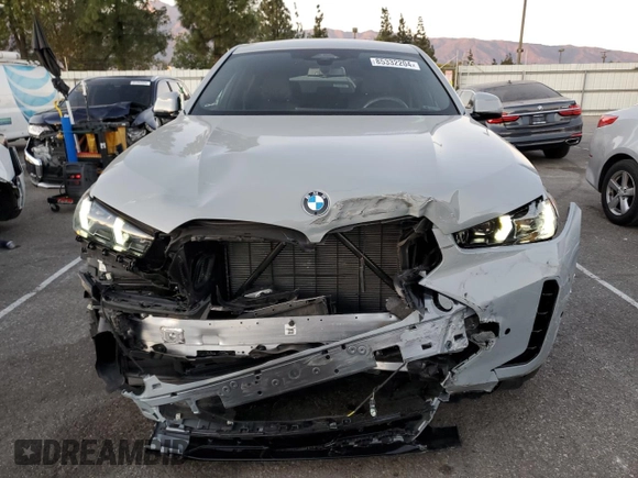 2024 BMW X6 xDrive40i with VIN 5UX33EX04R9T50214, listed as a Copart auction lot 85332204 with 8,710 mi miles and Salvage Title. Bid and sale history available at carsss.com. Image 5.