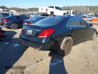 2015 Mercedes-Benz S-Class S 550 with VIN WDDUG8CB0FA077923, listed as a IAAI auction lot 41337033 with 121,957 mi miles. Bid and sale history available at carsss.com. Image 4.