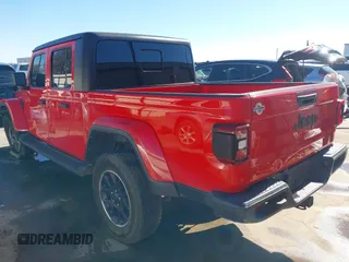 2021 Jeep Gladiator Freedom z VIN 1C6HJTAG7ML609661, wystawiony jako IAAI lot #41410756 z przebiegiem 44 636 mil mil oraz . Historia ofert i sprzedaży dostępna na DreamBid. Obrazek 3.