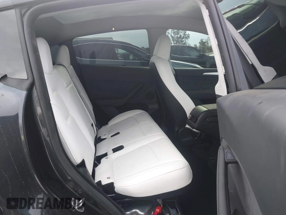 2024 Tesla Model Y with VIN 7SAYGDED8RF116209, listed as a IAAI auction lot 41761804 with 12,048 mi miles and . Bid and sale history available at DreamBid. Image 8.