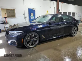 2019 BMW 5 Series M550i xDrive with VIN WBAJB9C52KB289235, listed as a Copart auction lot 49451575 with 60,370 mi miles and Salvage title. Bid and sale history available at DreamBid. Image 1.