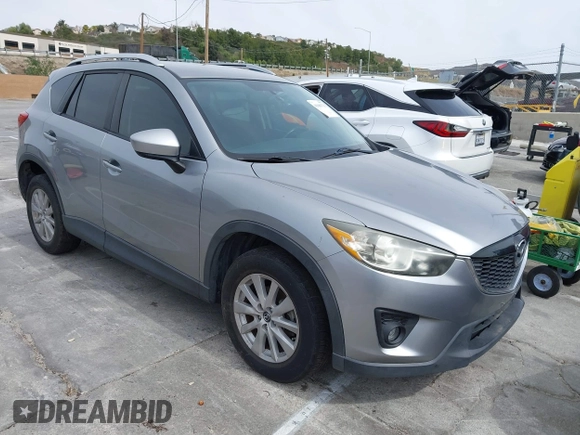 2014 Mazda CX-5 Touring with VIN JM3KE2CY3E0429025, listed as a IAAI auction lot 41680713 with 113,065 mi miles. Bid and sale history available at carsss.com. Image 1.