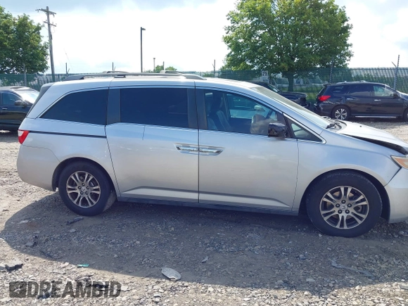 2012 Honda Odyssey EX-L with VIN 5FNRL5H61CB081634, listed as a IAAI auction lot 42760909 with 197,949 mi miles and . Bid and sale history available at DreamBid. Image 14.