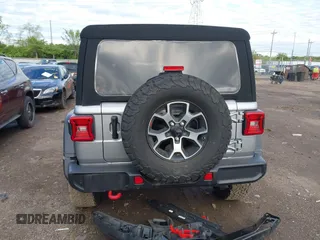 2021 Jeep Wrangler Unlimited Rubicon with VIN 1C4HJXFNXMW560512, listed as a IAAI auction lot 42124812 with 18,034 mi miles and . Bid and sale history available at DreamBid. Image 17.