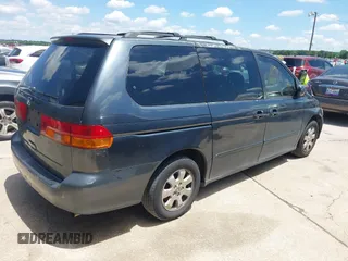 2004 Honda Odyssey EX-L with VIN 5FNRL18974B059223, listed as a IAAI auction lot 42249508 with 247,856 mi miles and . Bid and sale history available at DreamBid. Image 4.