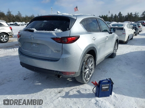 2021 Mazda CX-5 Grand Touring Reserve with VIN JM3KFBAY0M0377030, listed as a IAAI auction lot 41606709 with 39,590 mi miles. Bid and sale history available at carsss.com. Image 4.