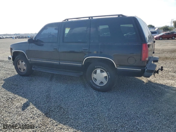 1999 Chevrolet Tahoe Z71 with VIN 1GNEK13R5XJ308924, listed as a Copart auction lot 64463984 with 229,181 mi miles and Salvage Title. Bid and sale history available at carsss.com. Image 2.