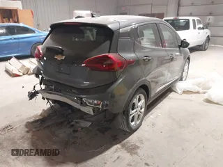 2021 Chevrolet Bolt EV LT z VIN 1G1FY6S05M4111315, wystawiony jako IAAI lot #41511422 z przebiegiem 14 433 mil mil oraz . Historia ofert i sprzedaży dostępna na DreamBid. Obrazek 4.
