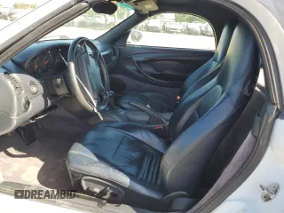 1999 Porsche Boxster с VIN WP0CA2981XU626335, выставлен на аукционе Copart как лот 58570495 с пробегом 140 751 миль миль и Списание • Salvage title. История ставок и продаж доступна на DreamBid. Изображение 7.
