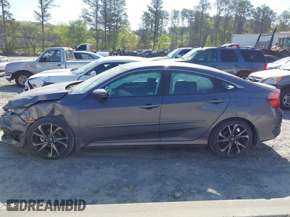 2019 Honda Civic Sport with VIN 2HGFC2F8XKH598141, listed as a IAAI auction lot 42013724 with 98,401 mi miles and . Bid and sale history available at DreamBid. Image 14.
