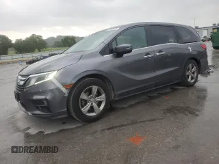 2018 Honda Odyssey EX with VIN 5FNRL6H50JB047999, listed as a Copart auction lot 57819495 with 121,295 mi miles and Salvage title. Bid and sale history available at DreamBid. Image 1.